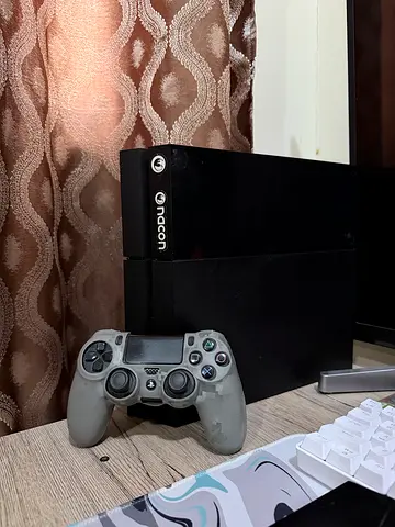 PlayStation 4 with 1 controller and 4 games