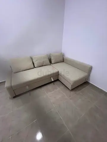 beige L-shaped corner sofa bed with storage - Good condition
