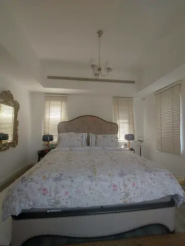 King Size Upholstered Bed with Floral Duvet — Good Condition