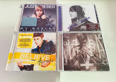 4 Justin Bieber Music CD’s