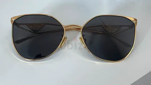 Prada gold-frame sunglasses with dark lenses - preowned