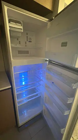 Silver Two-Door Refrigerator in Good Condition