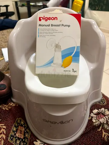 Manual breast pump/baby training seat