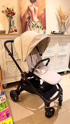 Well-kept beige standard stroller with canopy and storage basket