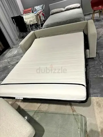 Light beige 2-seater sofa bed with mattress - good condition