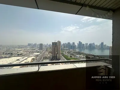 Two bedrooms and a living room for annual rent in Sharjah | With a balcony with an open view | With a maid's room | And a storage room | Prime locatio