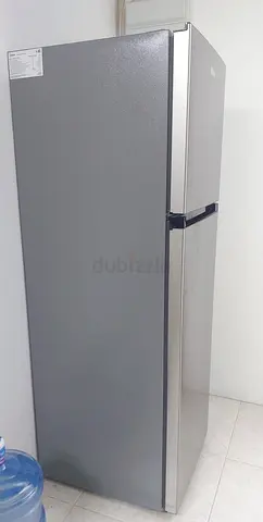 Silver two-door refrigerator - good working condition