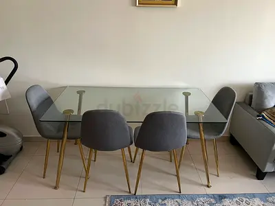 Glass Top Dining Table with 4 Grey Upholstered Chairs