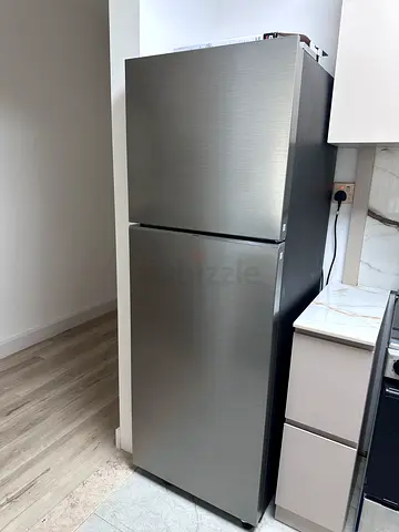 Used stainless steel double-door refrigerator - good condition