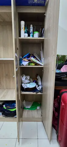 Light wood wardrobe/wardrobe cabinet with multiple shelves and wood cot - used