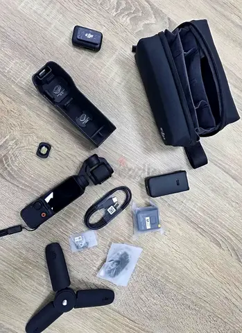DJI Osmo Pocket 3 cratoor pack with accessories — case, tripod, extra batteries, charging cables
