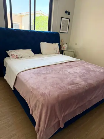 Blue upholstered king bed with headboard + mattress and side tables - good condition
