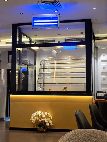 Modern Reception Counter with Glass Partition and Backlit Panel