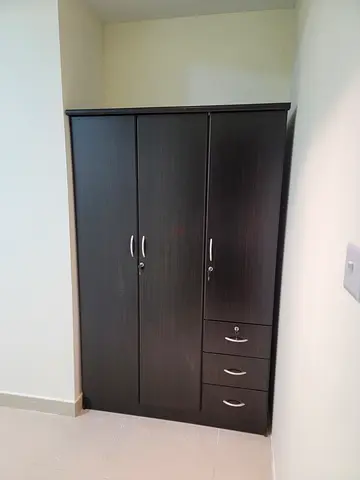 Dark Brown 3-Door Wardrobe with Drawers - Good Condition each aed 150 available end of this month