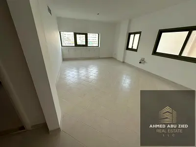 With free air conditioning, the largest two-bedroom apartment with a living room is available for annual rent in Sharjah. Prime location in Al Majaz 1