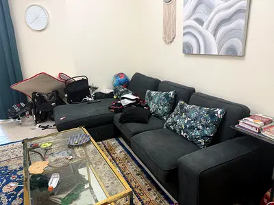 Dark grey L-shaped fabric sofa with chaise, good condition