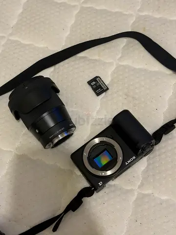Sony Alpha mirrorless camera body with 16-50mm lens, spare lens and 128GB SD card