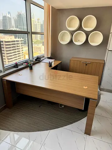 Modern wooden L-shaped executive office desk with file cabinet