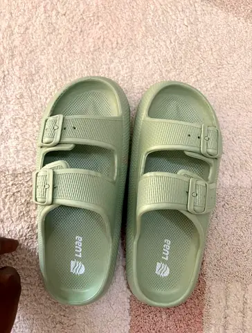 Light green double-strap slip-on sandals (size not specified)