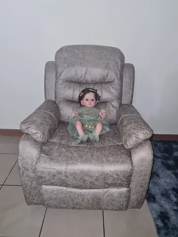 Grey recliner sofa with cream cover