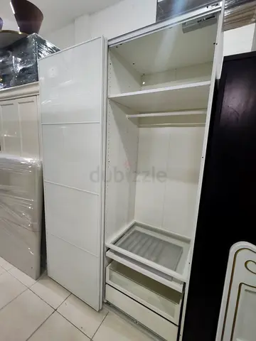 White Sliding Door Wardrobe / Armoire with Shelves and Drawers from ikea in perfect condition