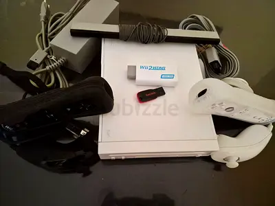 Nintendo Wii with all cables, 2 controllers and more than 50 games