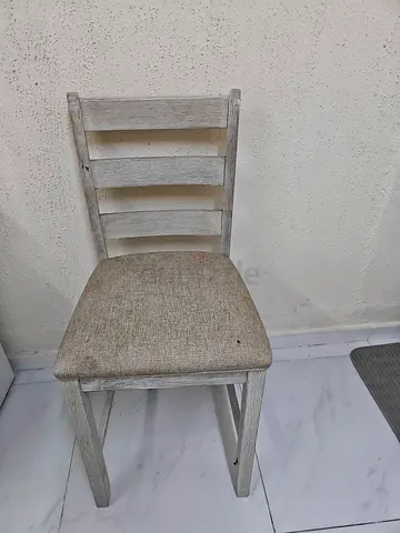 Used wooden dining chair with fabric seat — light distressed finish
