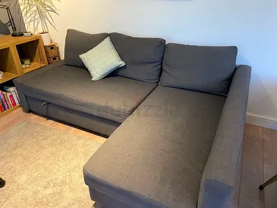 L-shaped grey fabric sofa with chaise — good condition