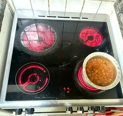 Used stainless steel electric oven with stovetop - good working condition