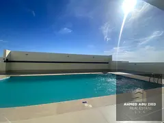First tenant 1BR apartment in Emirates City on MBZ Rd, open garden view, balcony, 2 baths, gym, pool