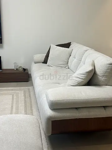 Light grey 3-seater sofa with matching ottoman — excellent condition