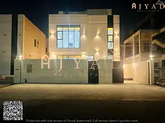 For sale: villa in Al Zahia Ajman, 4 master bedrooms, white stone facade, registration and ownership
