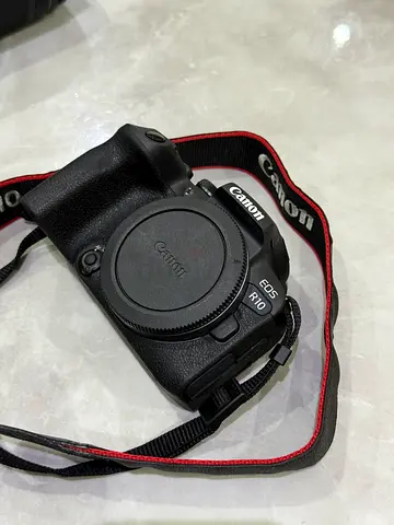 Canon EOS R10 mirrorless camera body (no lens) with strap - good condition