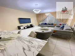 Sharjah Al Taawun, two-bedroom apartment, hall, kitchen, two bathrooms and balcony