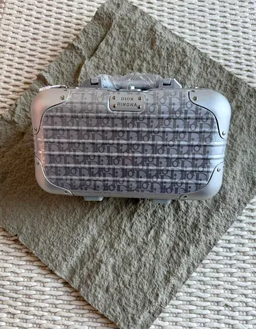 Dior Rimowa compact bag