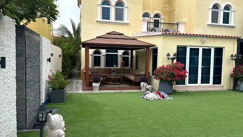 Outdoor gazebo with seating set on artificial grass - good condition