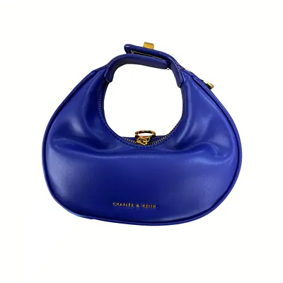 Charles  Keith small crescent shoulder bag in royal blue