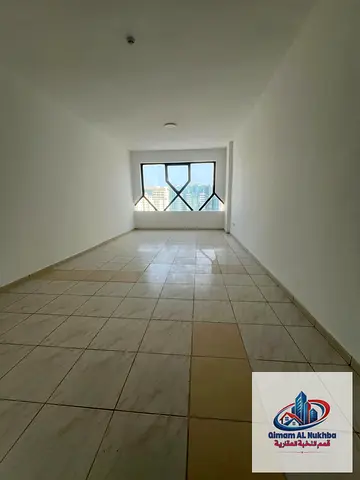 Two bedrooms and a living room for rent in Al Majaz 2, with two bathrooms, central air conditioning and gas, neat finishing, and a prime location clos