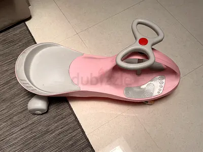 Pink toddler ride-on car / push scooter (good condition)