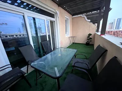 Outdoor dining set with glass table and 6 chairs