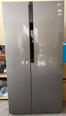 Model LG Side By Side Fridge Freezer with Digital Clock