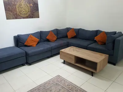 L-shaped Blue Fabric Corner Sofa with Ottoman and Coffee Table