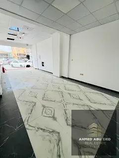 Commercial space for annual rent in Al Muwaihat 2, on the main road, 400 sq ft, prime location suita