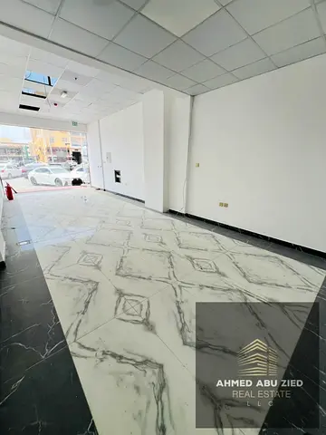 للايجار السنوي محل تجاري في المويهات 2 على الطريق الرئيسي مساحة 400 قدم موقع حيوي مناسب لجميع الأنشطة شهر مجاني نظام دفع مرن