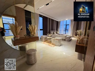 A luxurious villa in Al Helio 2 with a swimming pool, a roof, a spacious outdoor seating area, an elevator, and an elegant design on the corner of two