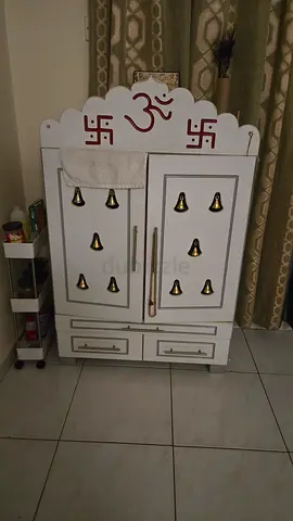 White wooden pooja mandir/shrine with drawers and storage