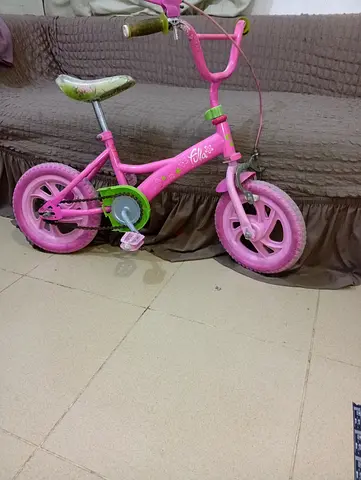 Small pink kids bicycle — 12 inch wheels, used