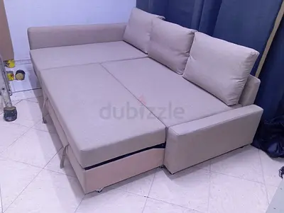 Light beige fabric sofa bed with storage - converts to double bed
