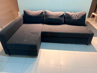 L-shaped dark grey fabric sofa with chaise - good condition