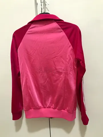 Adidas pink jacket for 13-14 years for 75 aed.